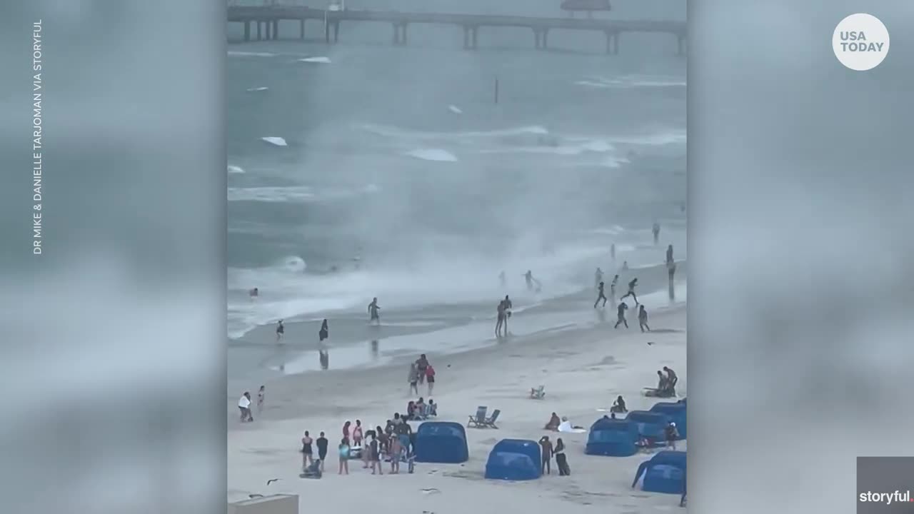 Chalmeras capture waters pout ripping through crowded beach usa