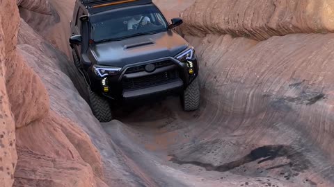 SUV Climbs Steep Slope