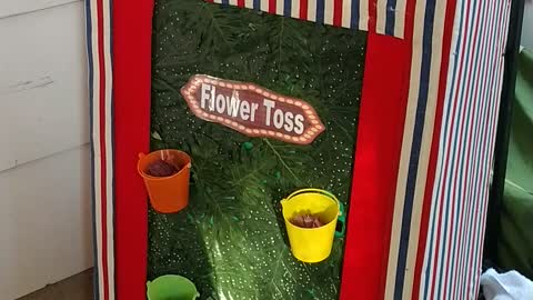 Flower toss carnival game run by the ringmaster at a birthday party in Humble texas