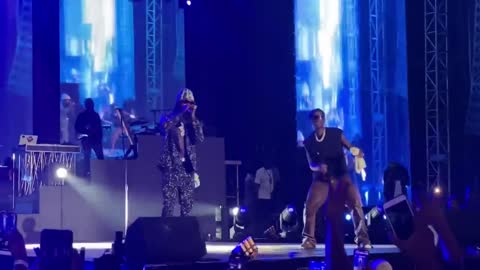 Naira Marley on stage with Wizkid