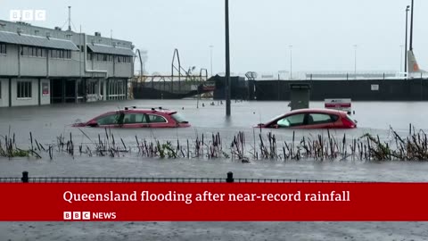 Queensland floods: Australia airport submerged and crocodiles seen after record rain | BBC News