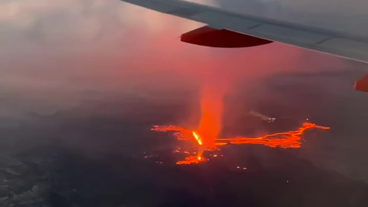 SEE IT: A passenger films a volcanic eruption in Iceland from an airplane.
