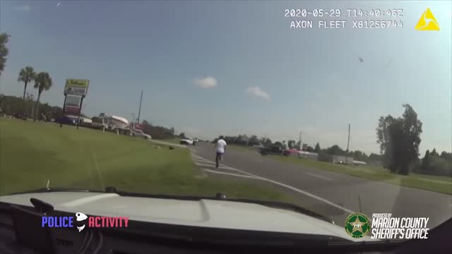 Armed Fleeing Suspect Tries To Carjack A Driver After He Crashes His Car During Police Chase