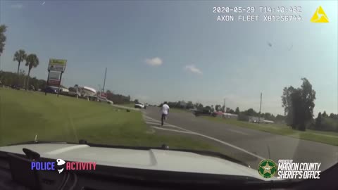 Armed Fleeing Suspect Tries To Carjack A Driver After He Crashes His Car During Police Chase