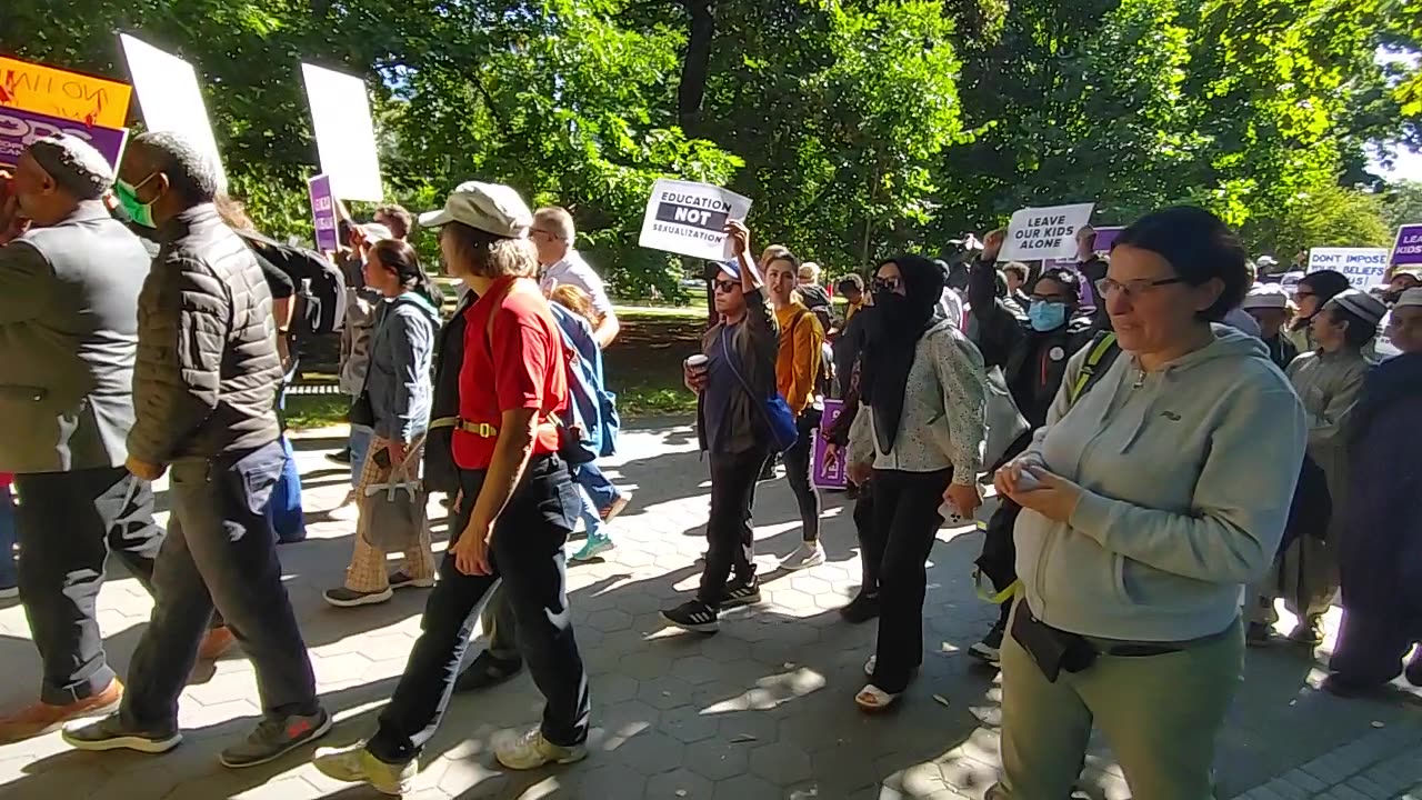 People walking to the "1 million march for children" march from Queen's park.