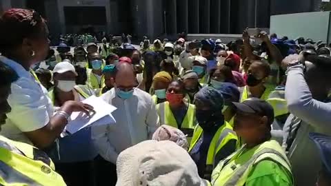 Community members working on the Walking Bus Project gathered at the Cape Town Civic Centre.