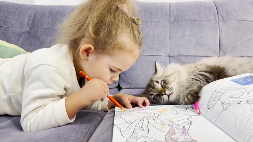 Adorable Little Girl Teaches Her Cat Theo to Draw