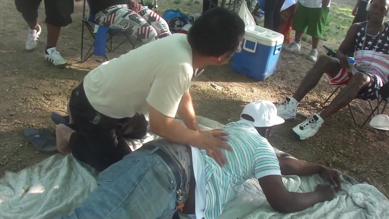 Luodong Massages Black Man In Stripes At The Picnic