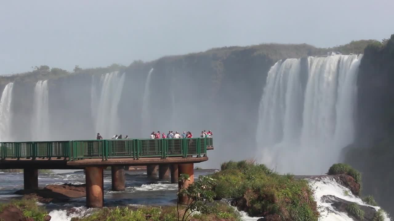 People Enjoying the Waterfall Scenery from the View deck