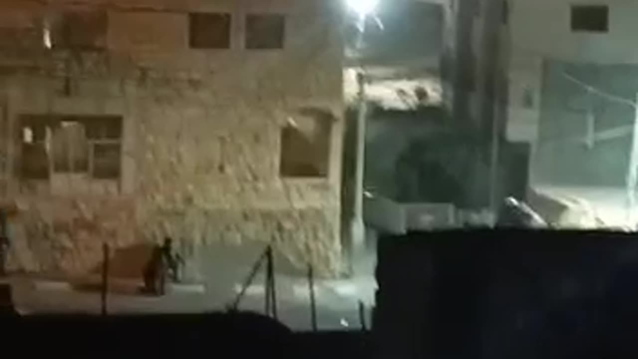 Palestinian with bulldozer classes with IDF in Hebron