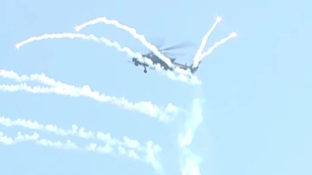 Zhi-20, Zhi-10 and Zhi-8L aircraft perform "Sky Girl Dispersing Flowers"