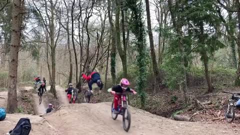 Guys Trip And Fall On Road While Cycling In a Group