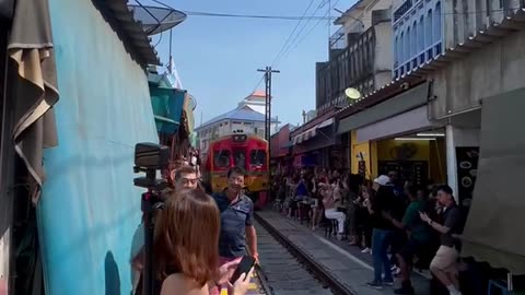 Dangerous railway tracks , Maeklong Railway Market Thailand 🇹🇭