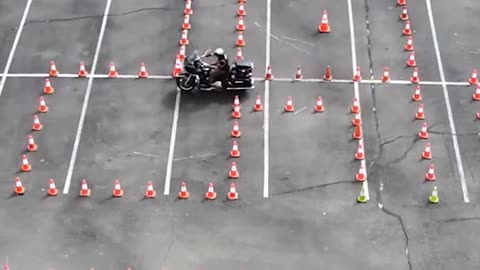 Riding a motorcycle in a cone maze!