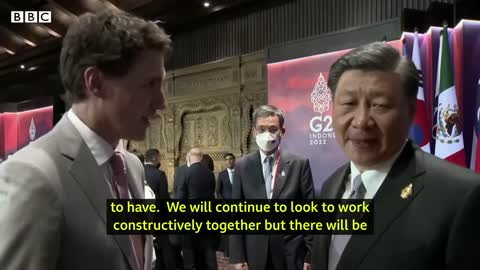 China and Canada leaders caught having tense exchange on camera - BBC News