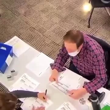 Filling in blank ballots and stamping them !!!