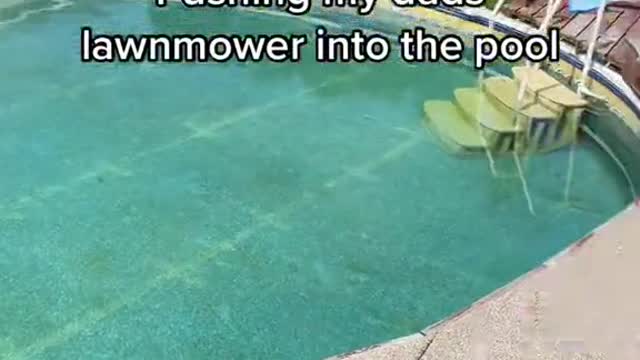 Pushing my dads lawnmower into the pool