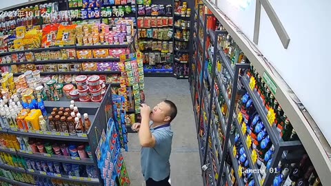 In the supermarket, stealing booze.在超市里，偷酒喝。