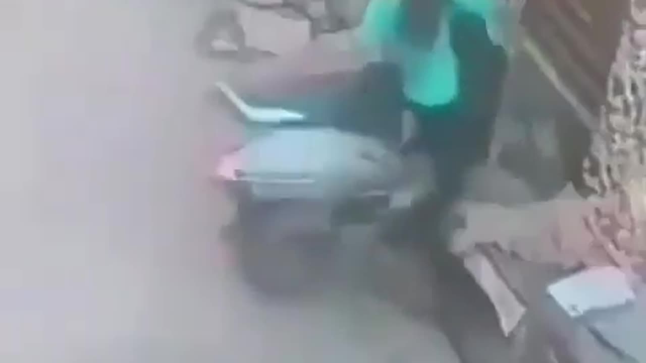 chick flips out on scooter.