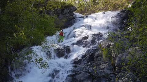 Skier Came Rolling Down On River Rocks