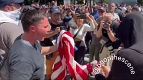 Migrant Supporters Attempt to Burn American Flag at NYC Protest