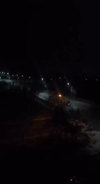 Unidentified luminous objects fly right near residential buildings.