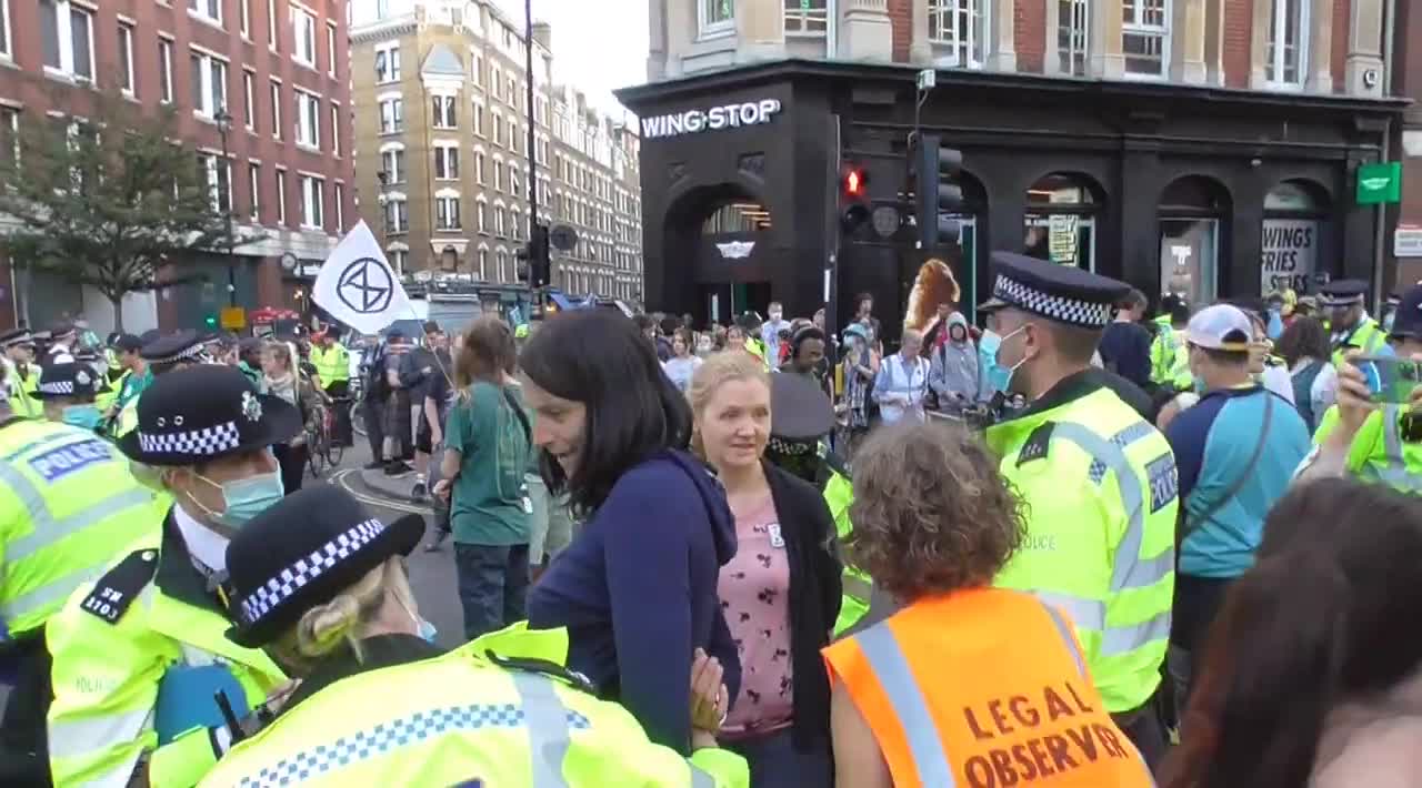 Extinction rebellion more arrests Obstruction of the highway two women chained to a concrete object