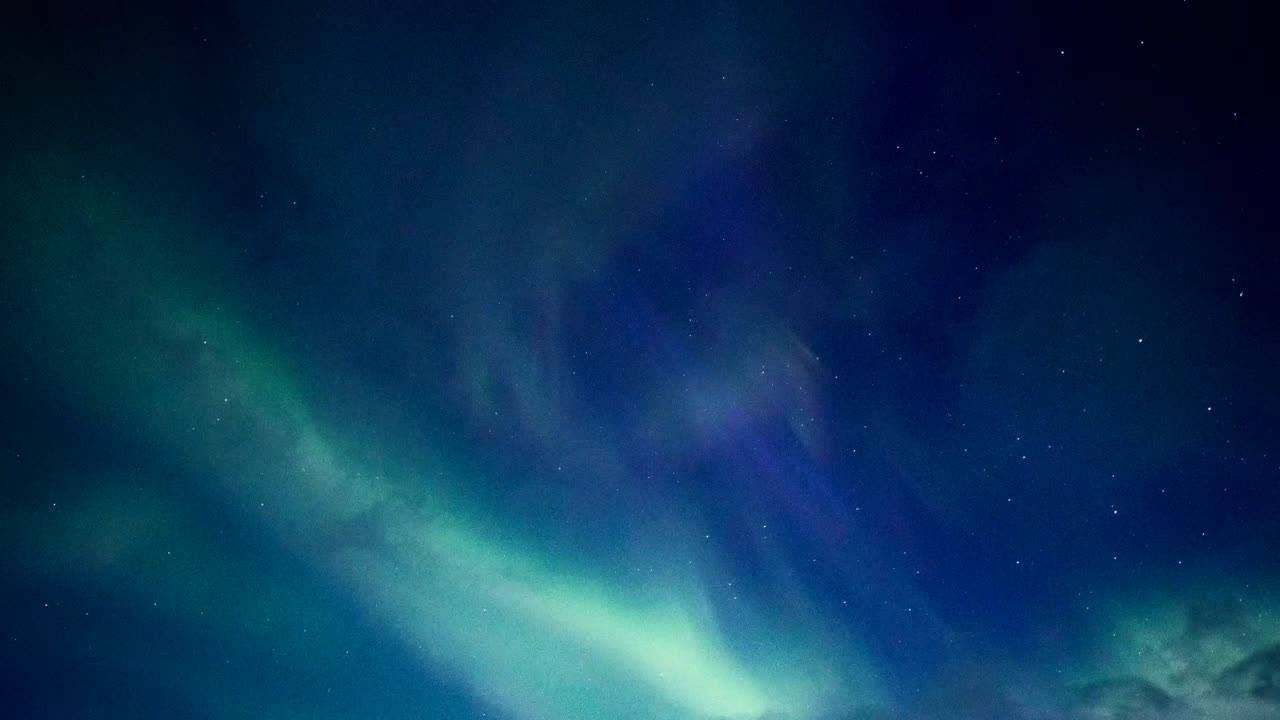 Northern Lights of blue and green colors in the night sky