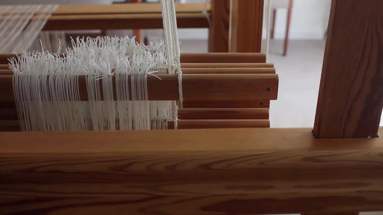 Weaving a linen cloth using a handmade Japanese boat shuttle