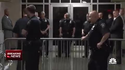 Donald Trump enters New York City courtroom following arrest processing