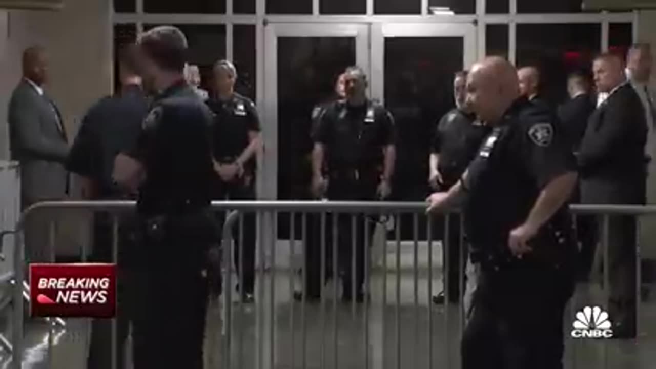 Donald Trump enters New York City courtroom following arrest processing