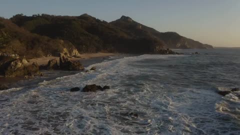 mixkit-beautiful-aerial-shot-of-beach-shore