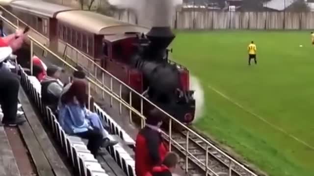 Train goes through football stadium