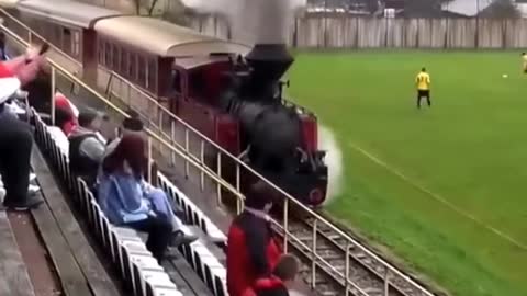 Train goes through football stadium