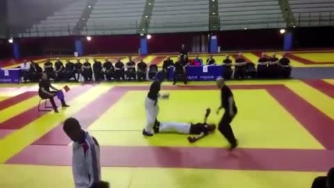 Wrestler Knocks Down Her Opponent With A Quick Hit