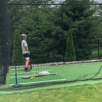 Kid hits himself in the nuts in batting cage
