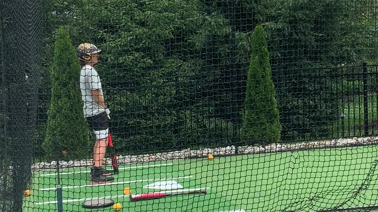 Kid hits himself in the nuts in batting cage