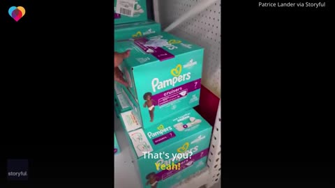 21_Little girl spots her photo on box of diapers in store