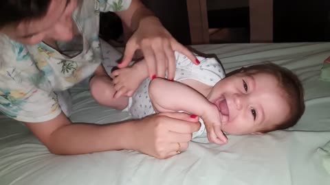 Funny cute lovely baby playing and laughing