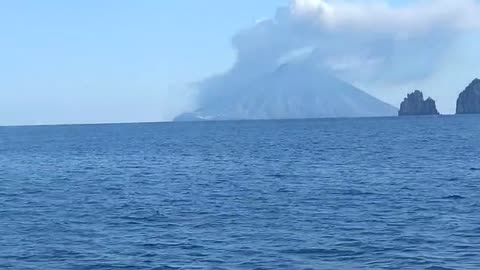 Stromboli Volcano looks lively from afar, as lava spills into sea