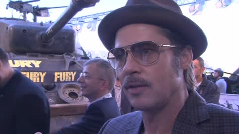 Brad Pitt invites war veteran onto red carpet