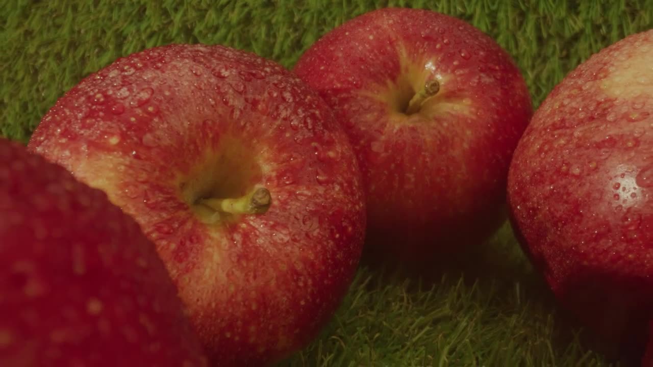 Fresh apples in a row on a natural background