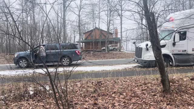 Delivery Truck Gets Stuck and SUV Pulls it Out