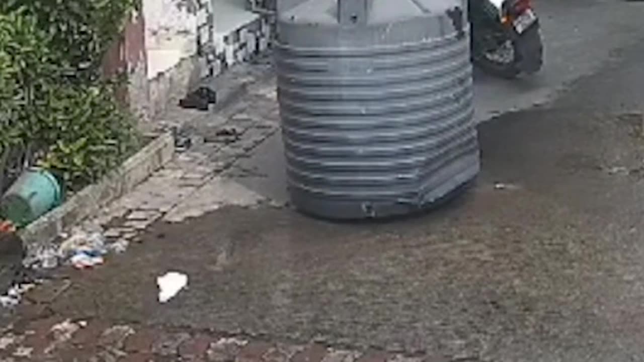 Woman miraculously escapes injury after water tank falls on her