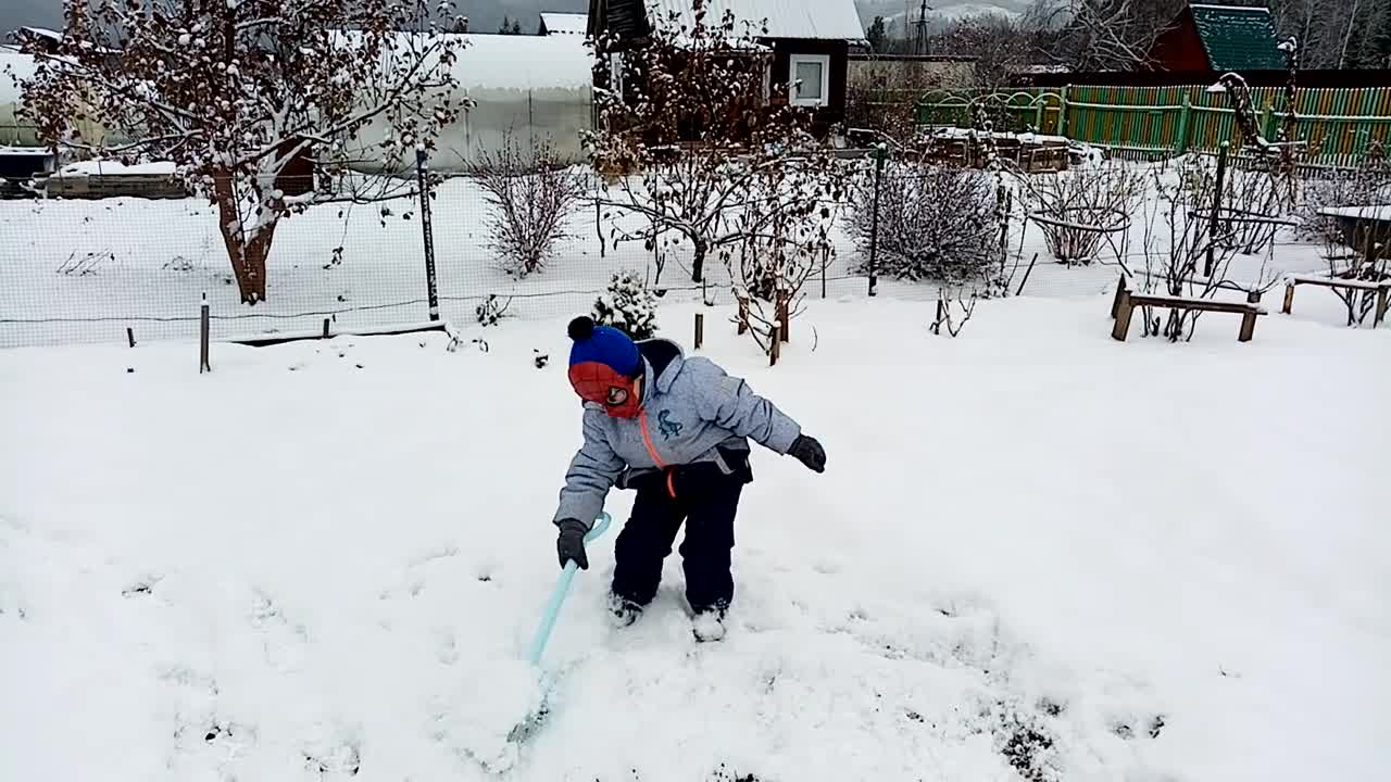 my brother cleans the snow