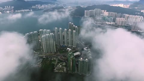 Drone in clouds with City view