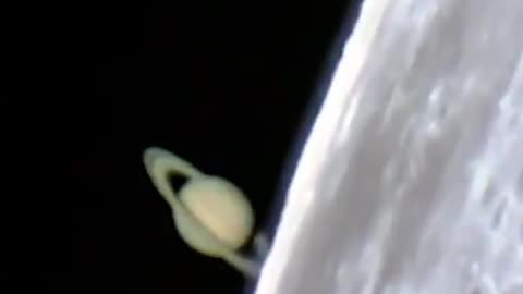 Incredible footage of Saturn rising from behind the Moon