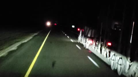 Passing a car hauler at night: 112 km/hr.