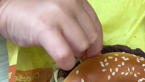 Naomi trying burger in Mcdonalds for the first time