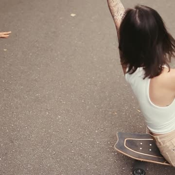 Woman Walking in Dress With Rose